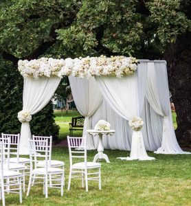 wedding canopy white sheer styled peonies