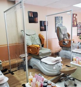 social distancing wall in a nail salon